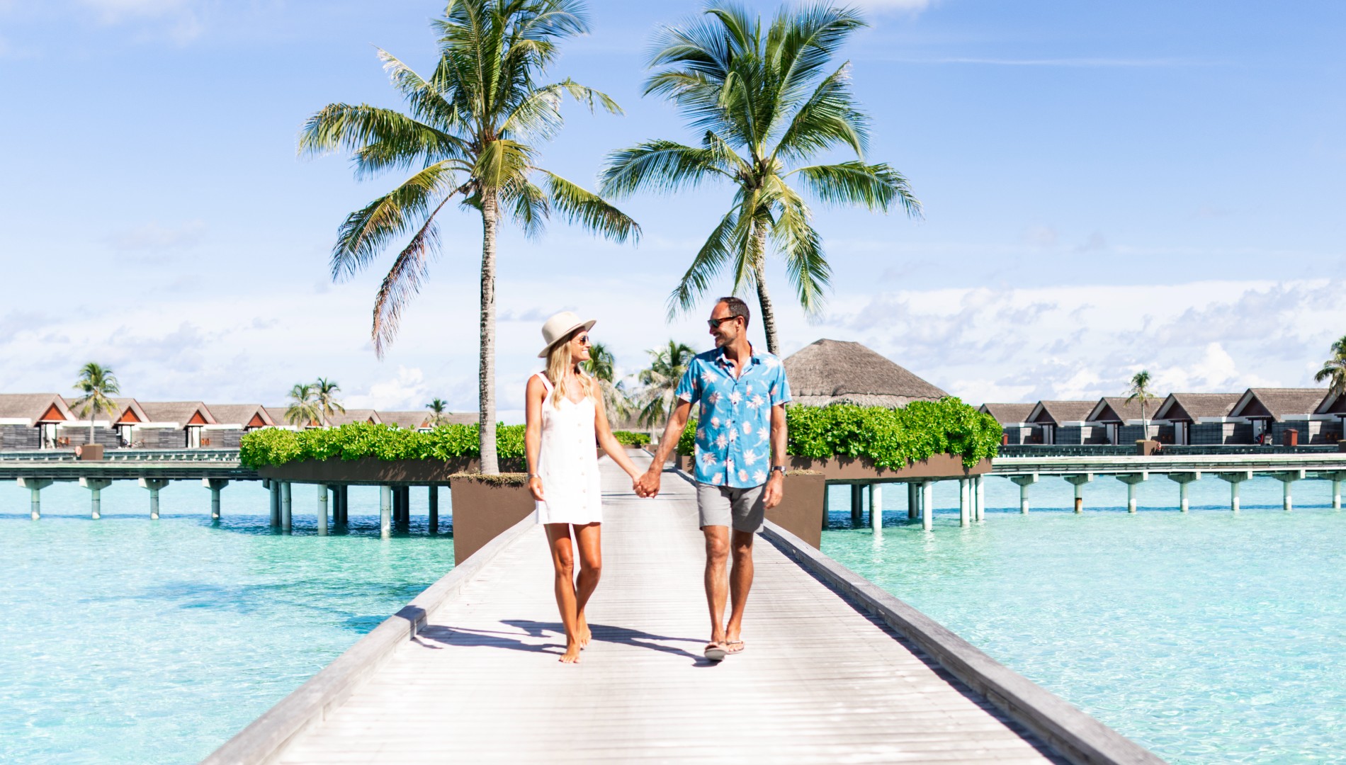 Niyama_Private_Islands, Maldives_Couple_Enjoying_Walk_On The_Island_1900x1080.jpg