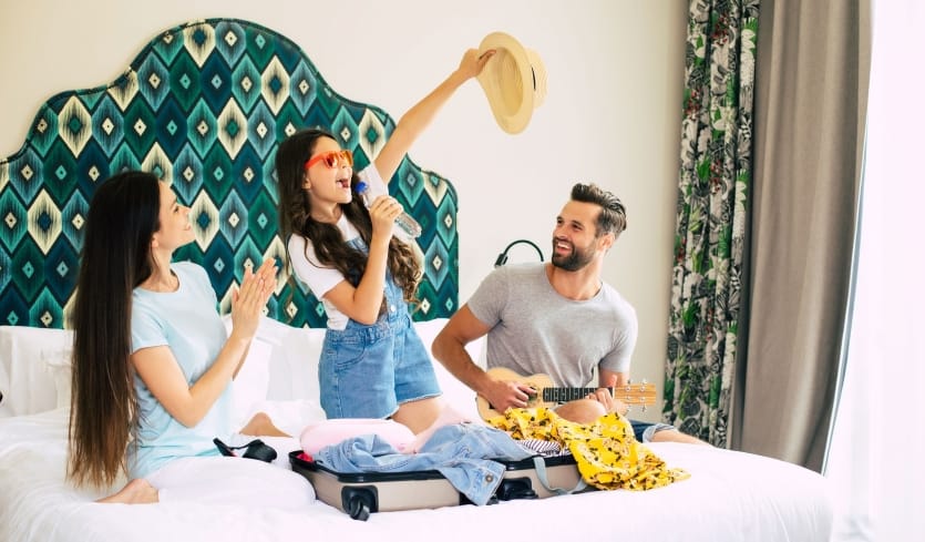 Friends enjoying their staycation in a luxury hotel room